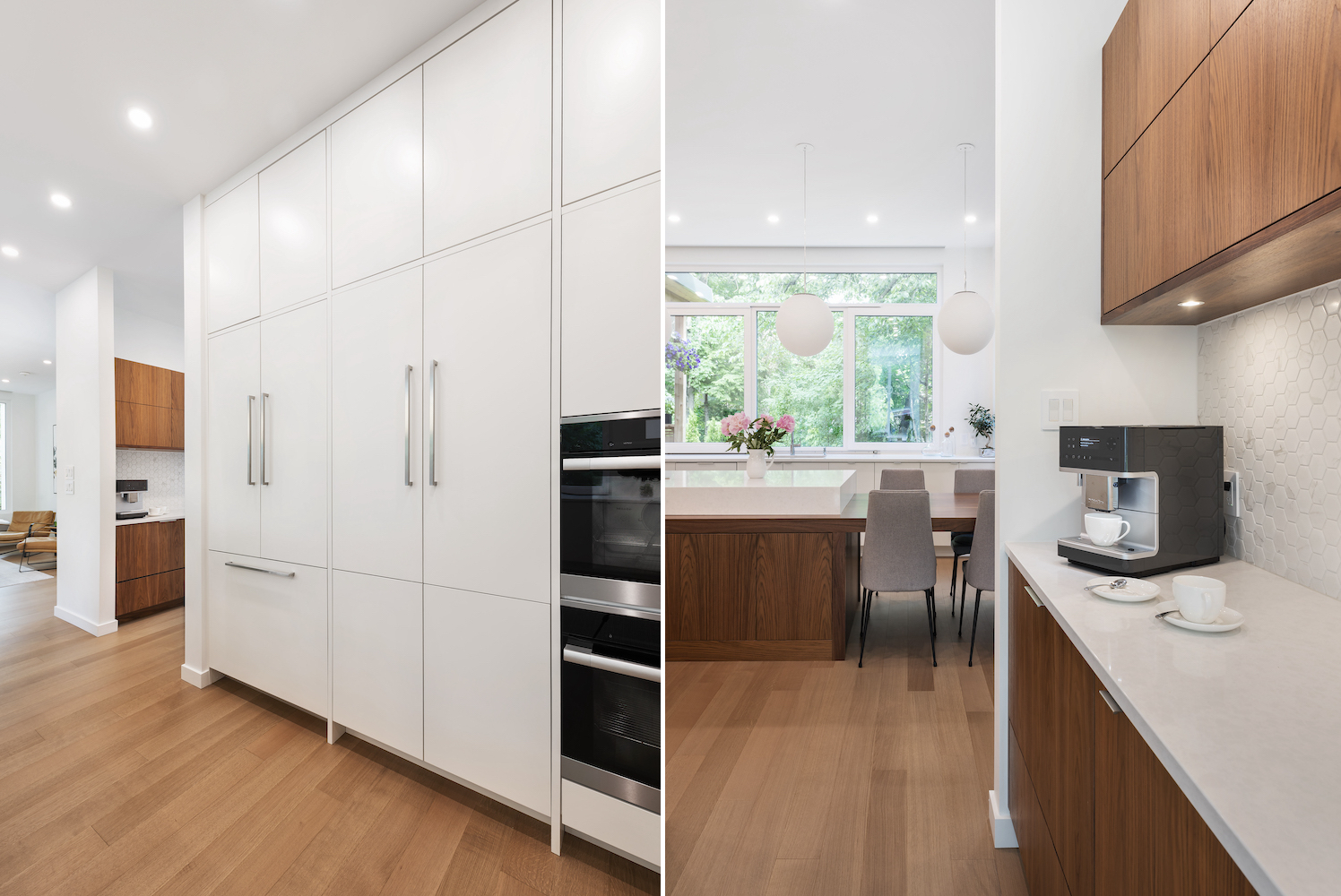 Contemporary kitchen design featuring sleek white cabinetry, built in appliances and panel ready appliances, and natural walnut accents. Includes a coffee machine on a white countertop, with a spacious island and large windows providing natural light and garden views.